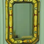 a vintage moroccan bone and brass decorated wall mirror