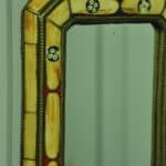 a vintage moroccan bone and brass decorated wall mirror