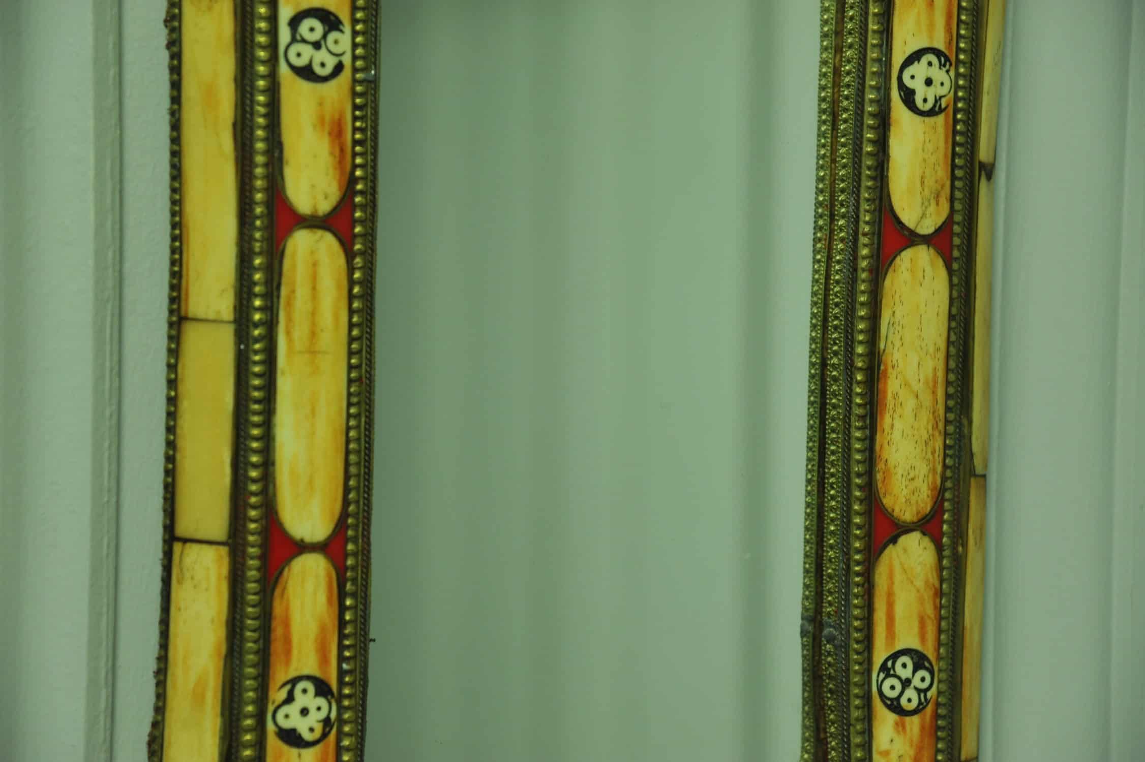 a vintage moroccan bone and brass decorated wall mirror