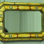 a vintage moroccan bone and brass decorated wall mirror