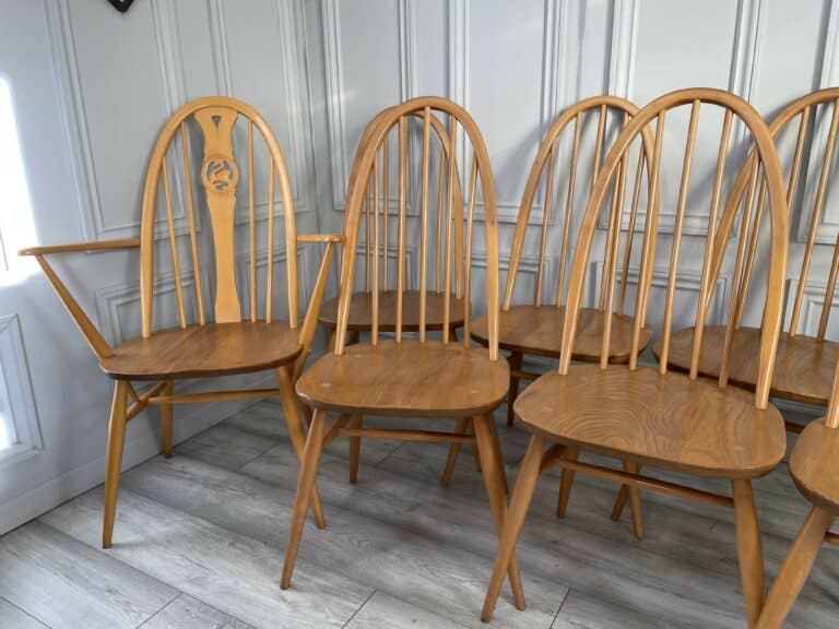 set of eight vintage ercol quaker dining chairs including two swan back carvers