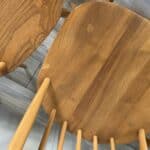set of eight vintage ercol quaker dining chairs including two swan back carvers