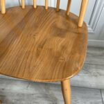 set of eight vintage ercol quaker dining chairs including two swan back carvers