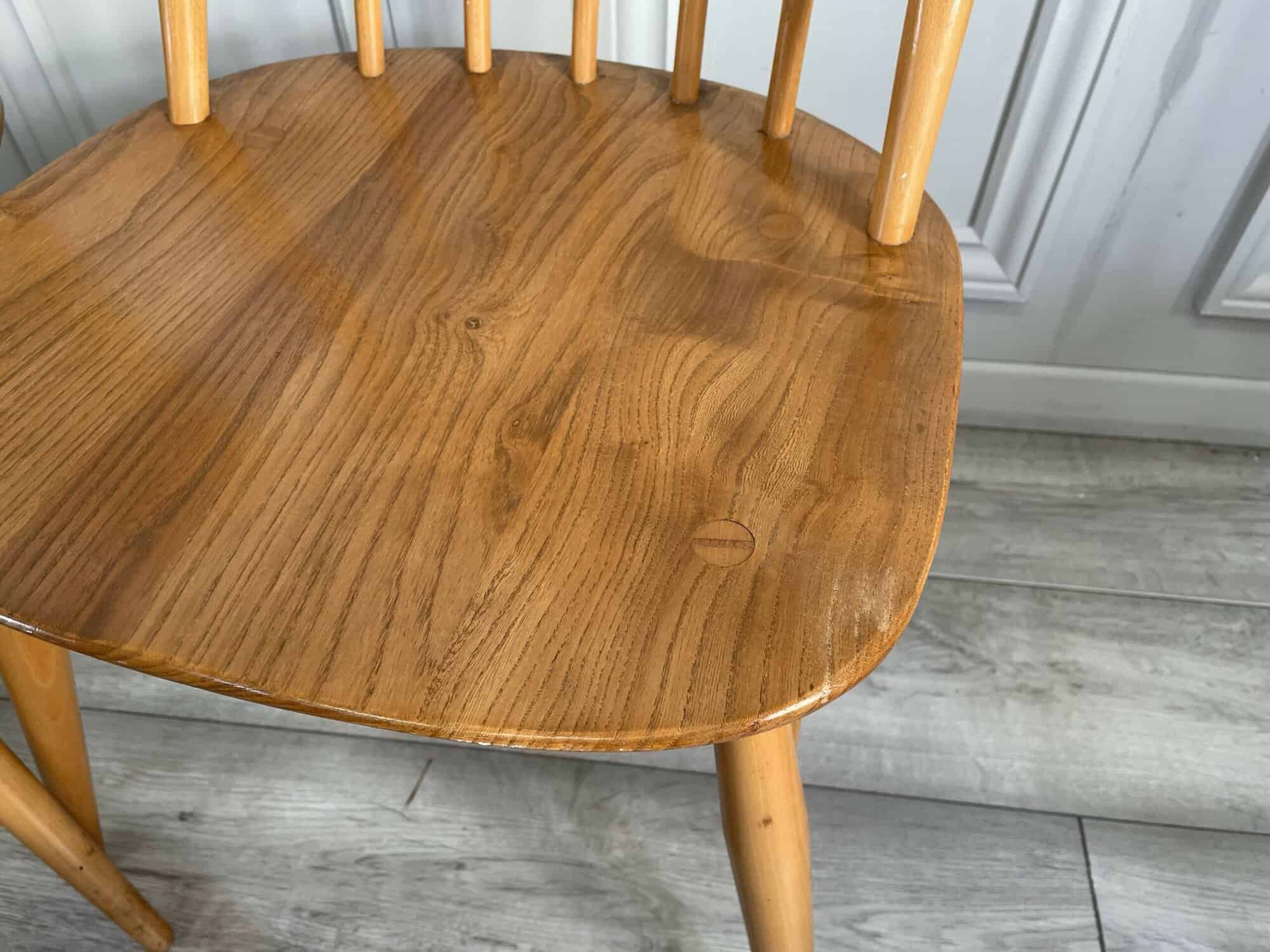 set of eight vintage ercol quaker dining chairs including two swan back carvers