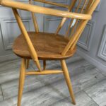 set of eight vintage ercol quaker dining chairs including two swan back carvers