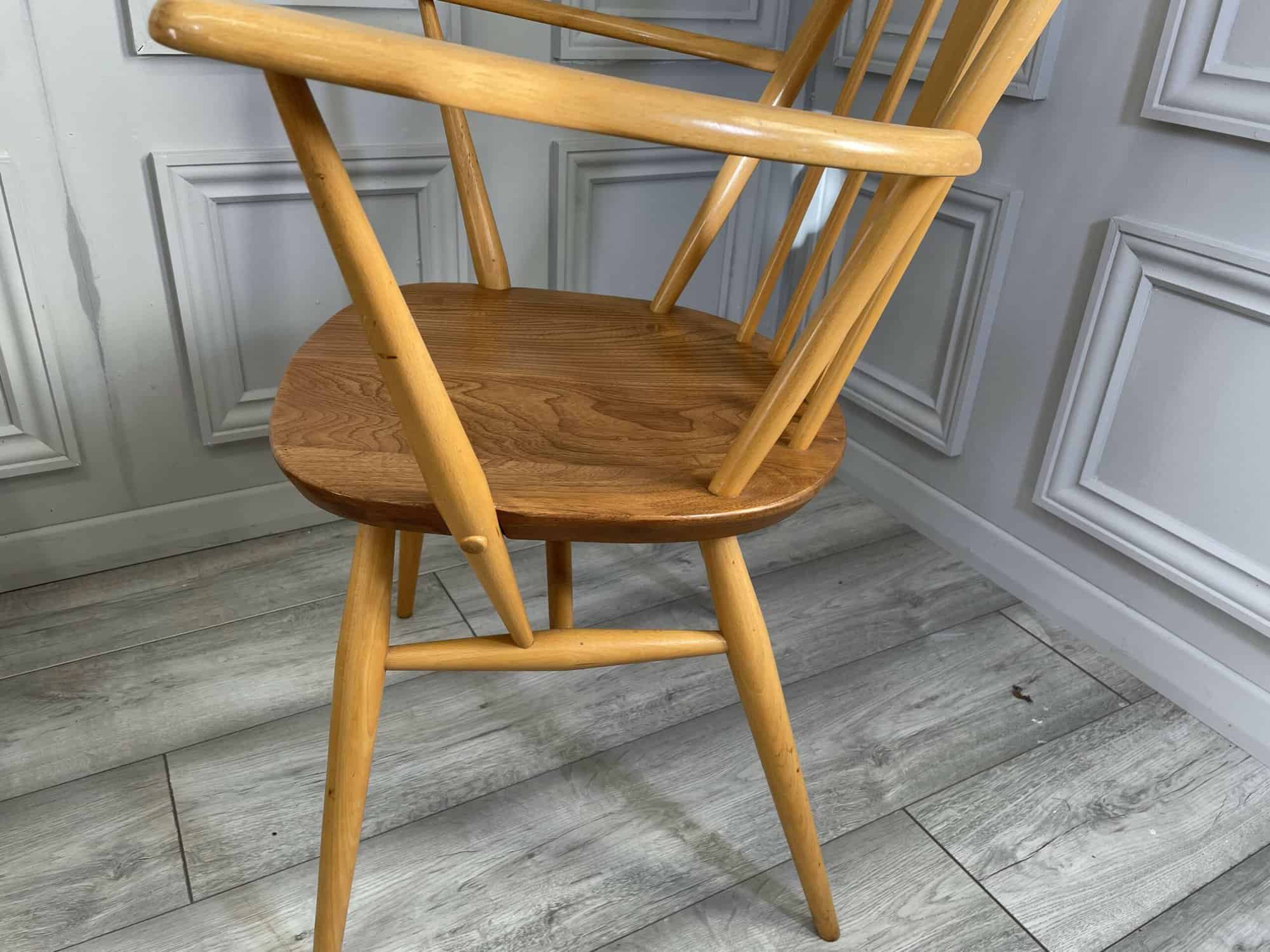 set of eight vintage ercol quaker dining chairs including two swan back carvers
