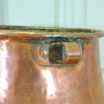 an antique french copper pot