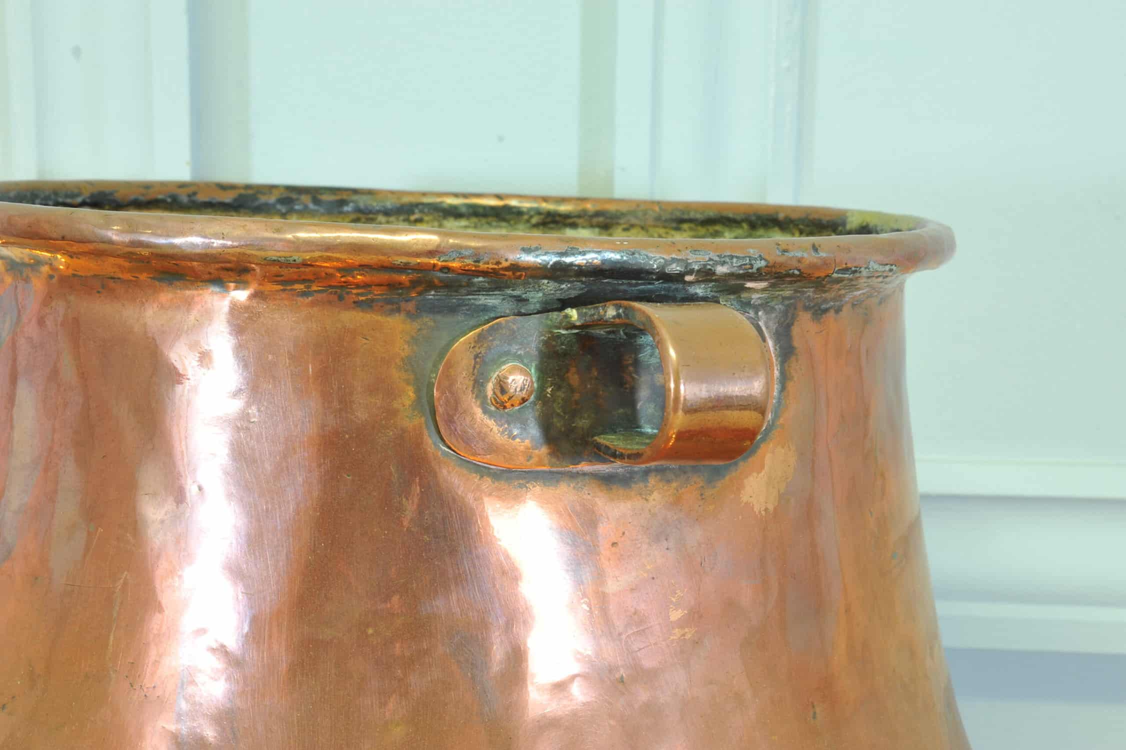 an antique french copper pot