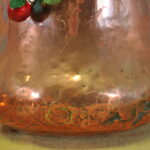 an antique french copper pot