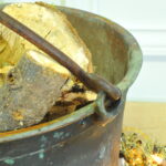 a very large antique french copper cauldron