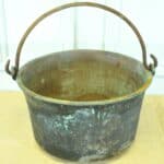 a very large antique french copper cauldron