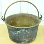 a very large antique french copper cauldron