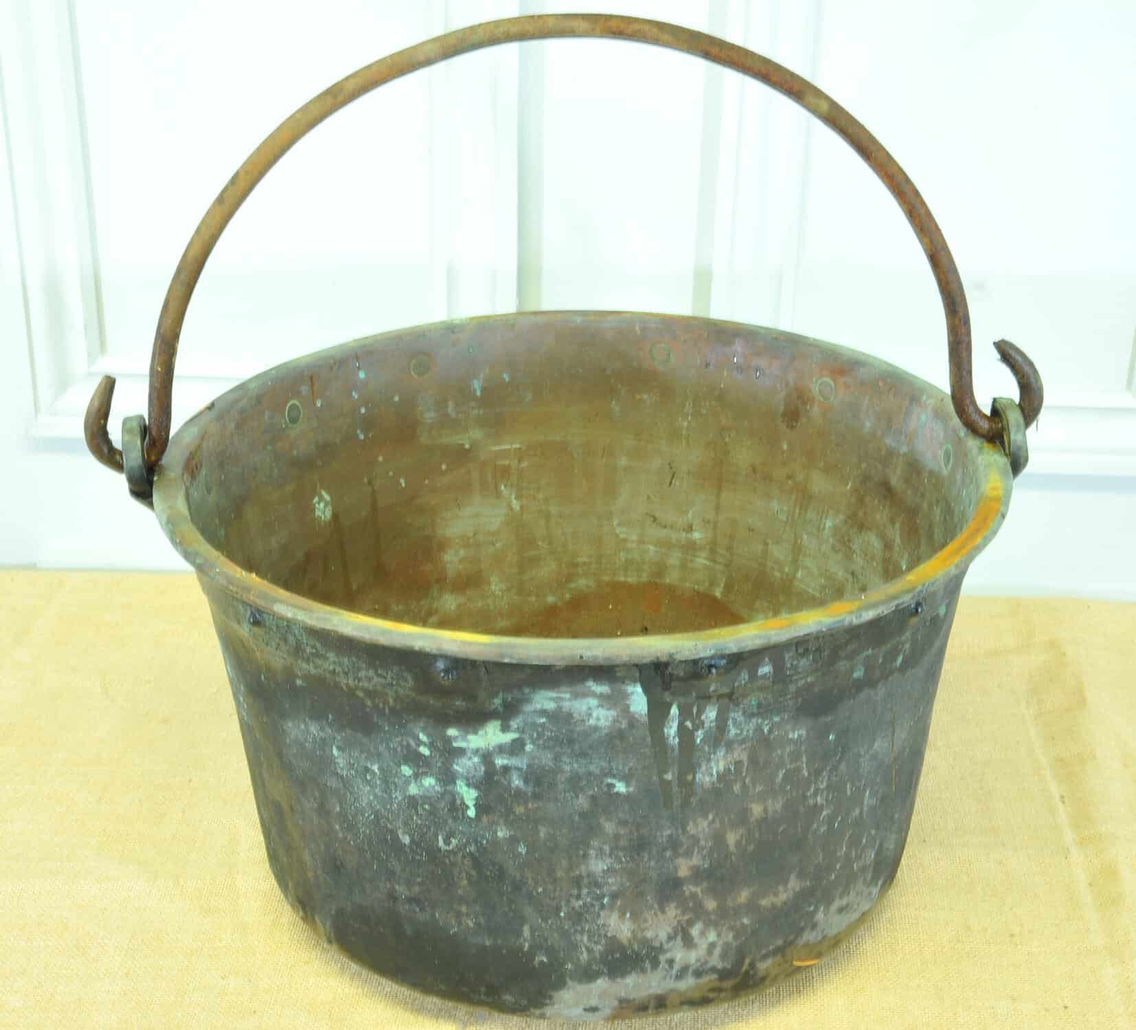 a very large antique french copper cauldron