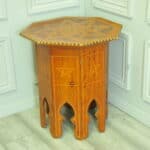 an antique vintage hexagonal satinwood side table