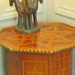 an antique vintage hexagonal satinwood side table