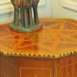 an antique vintage hexagonal satinwood side table