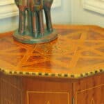 an antique vintage hexagonal satinwood side table