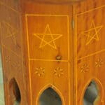 an antique vintage hexagonal satinwood side table