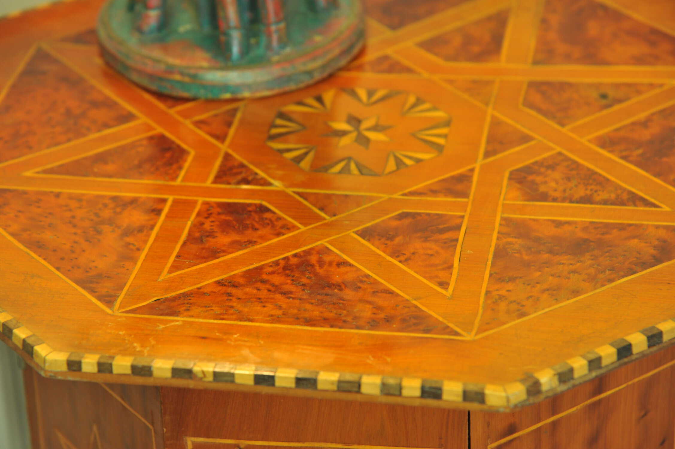 an antique vintage hexagonal satinwood side table