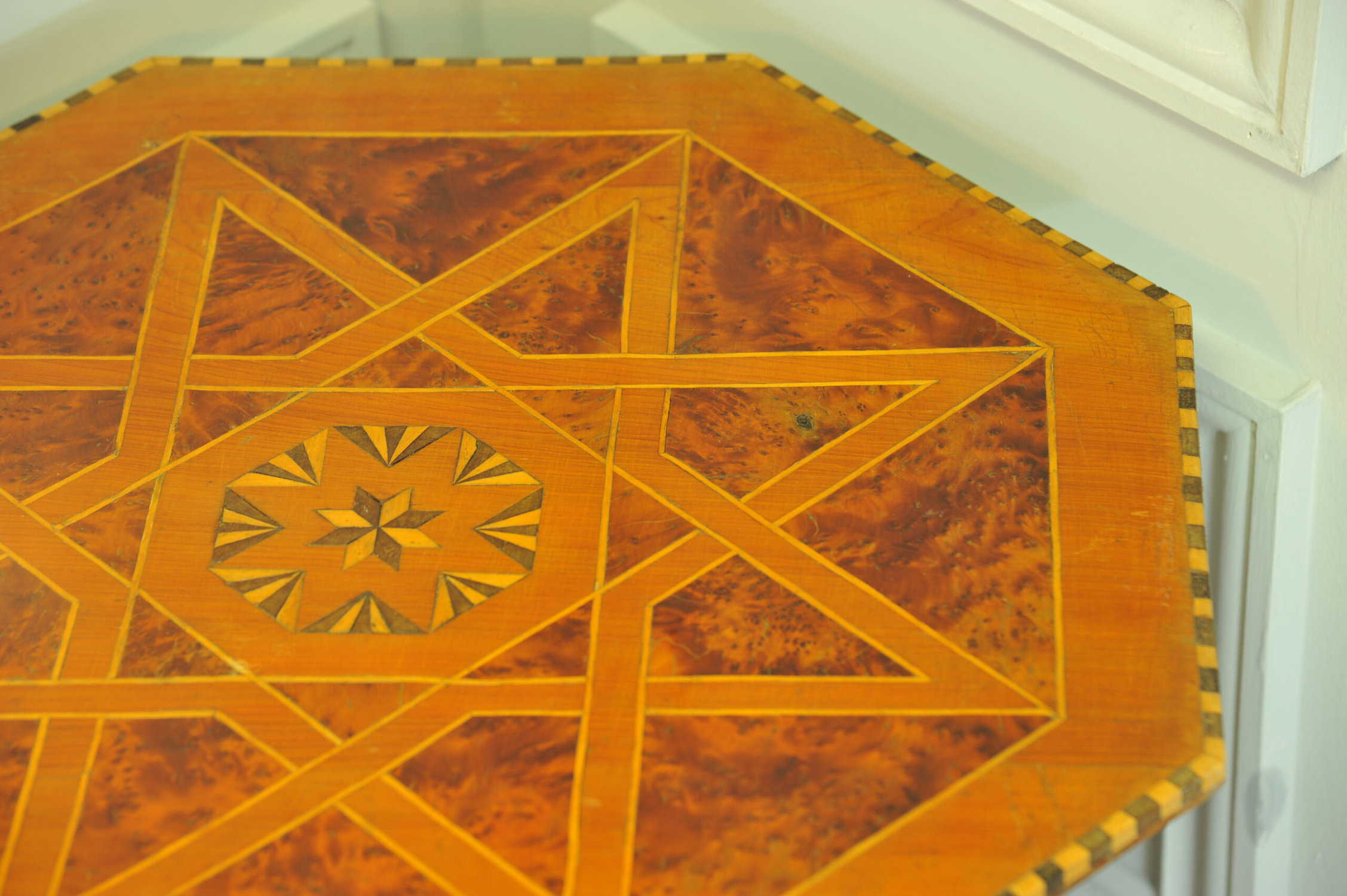 an antique vintage hexagonal satinwood side table