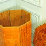 an antique vintage hexagonal satinwood side table