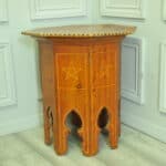 an antique vintage hexagonal satinwood side table