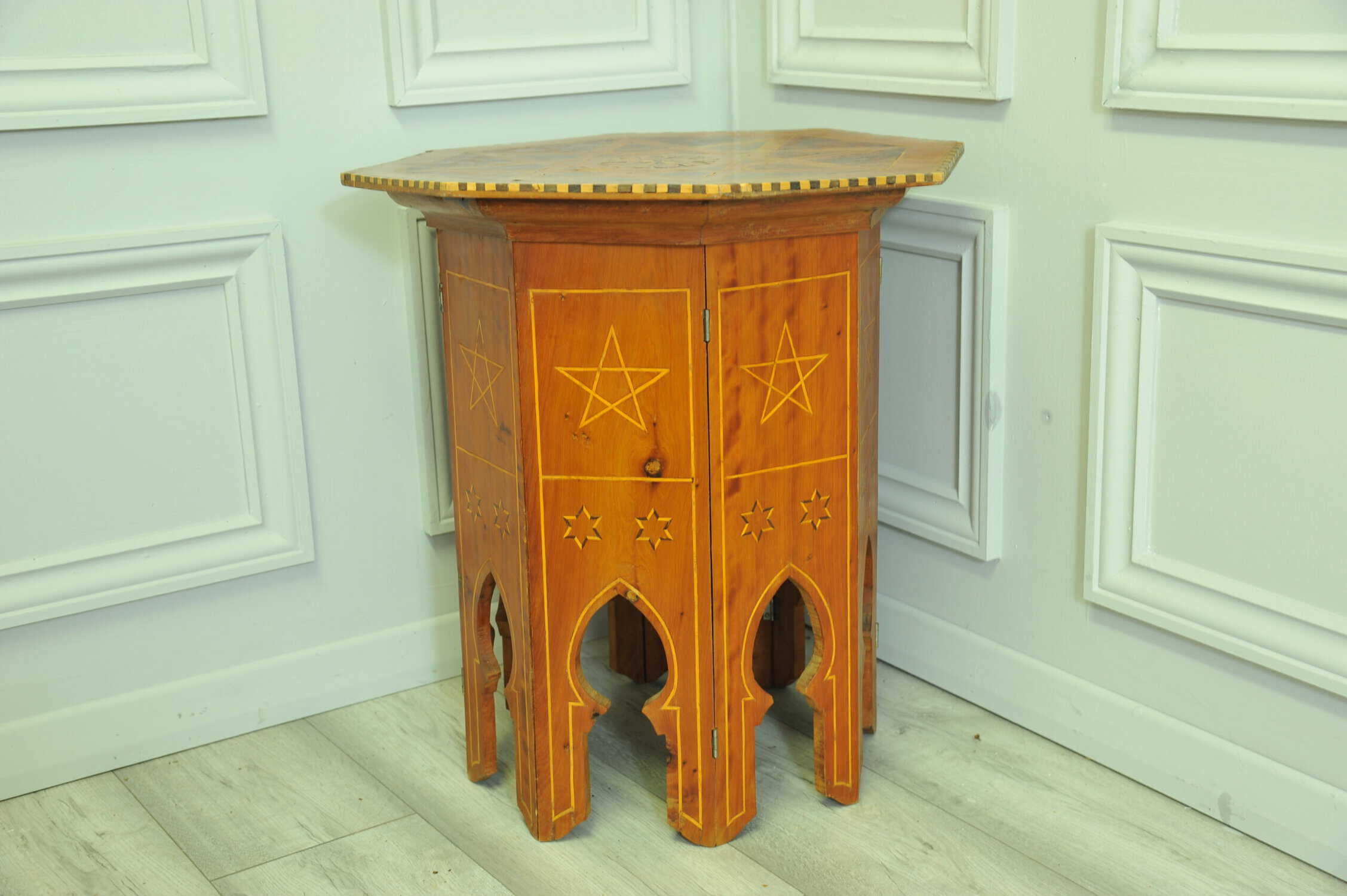 an antique vintage hexagonal satinwood side table