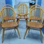 a set of six vintage ercol windsor hoop back chairs including two carvers