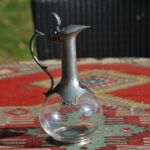 Vintage French glass and pewter decanter by Les Etains de Paris with bulbous body and slender neck.