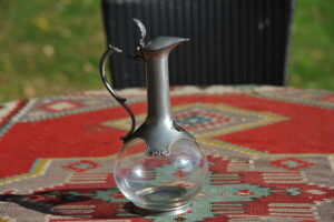 Vintage French glass and pewter decanter by Les Etains de Paris with bulbous body and slender neck.