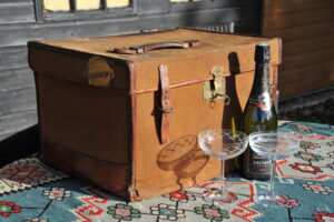 A vintage brown canvas and leather overnight weekend picnic classic car travel case trunk