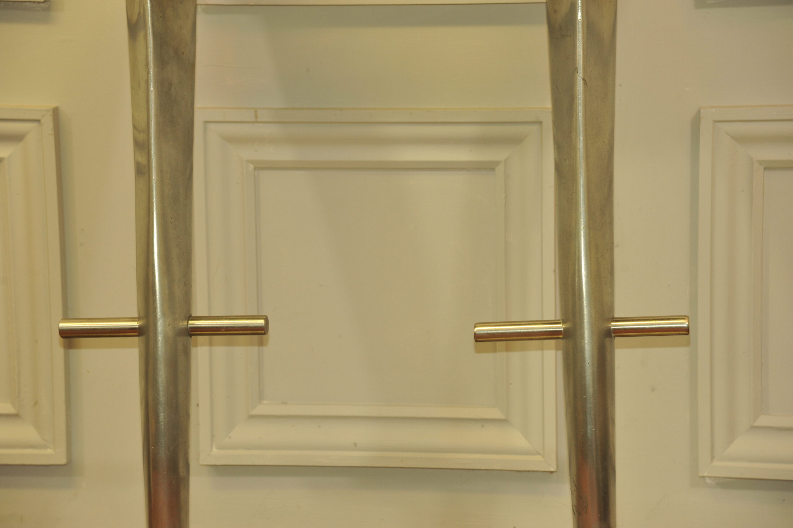 a pair of mid c swivel bar stools in solid pewter