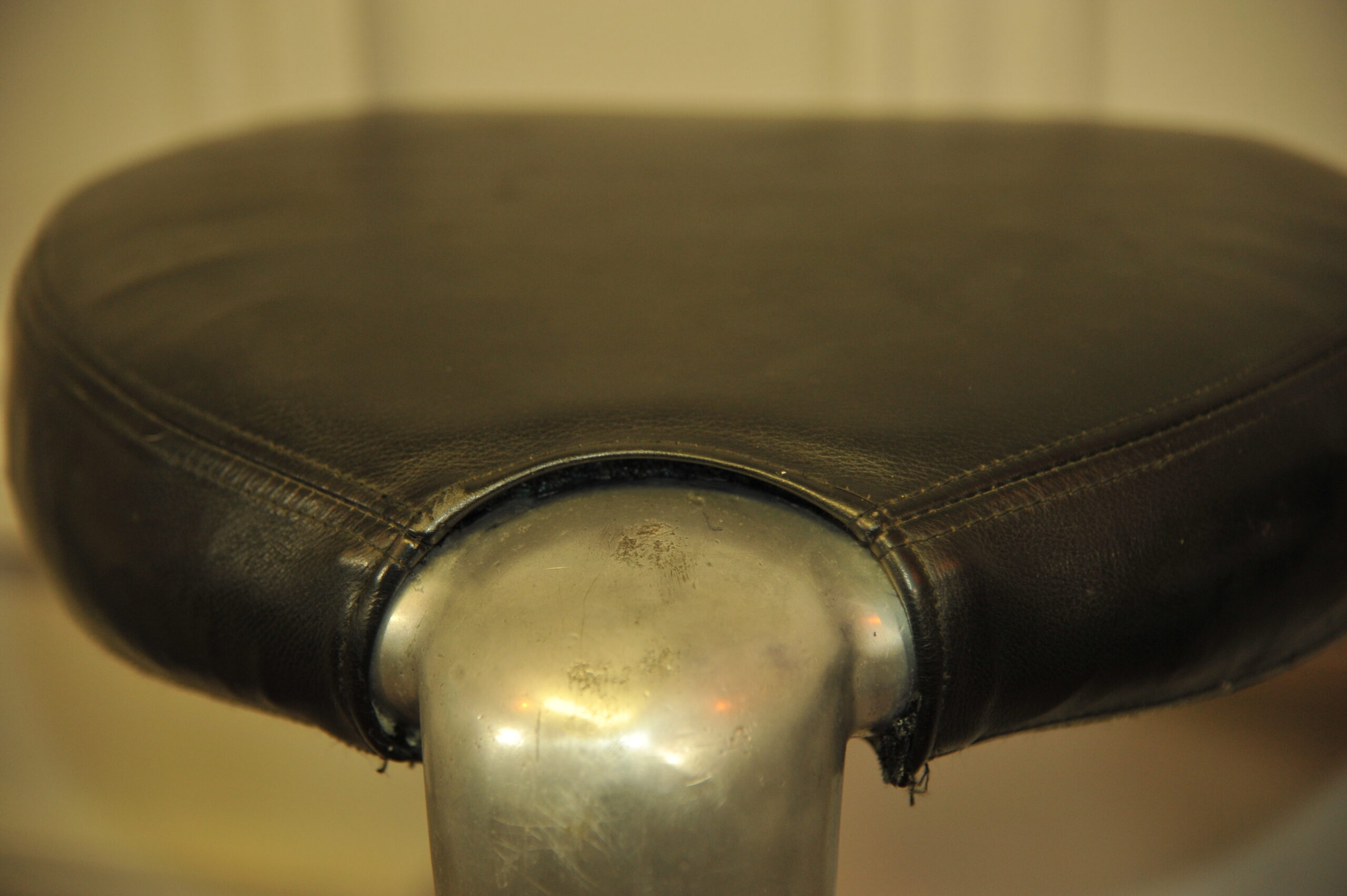 a pair of mid c swivel bar stools in solid pewter