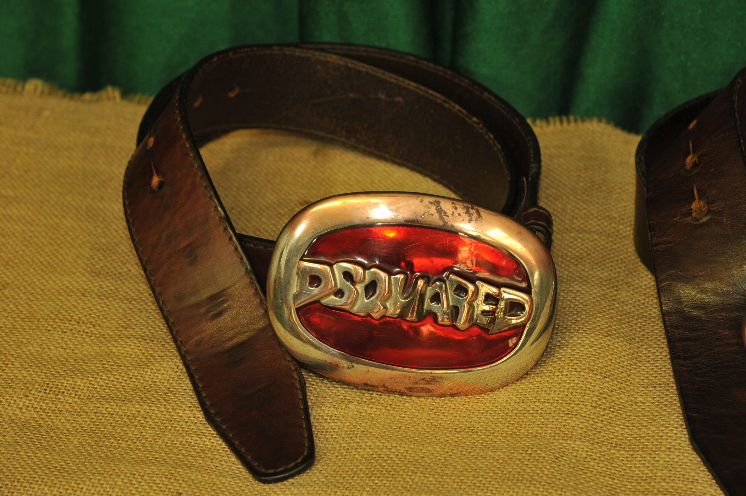 a pair of vintage collectible dsquared leather belts