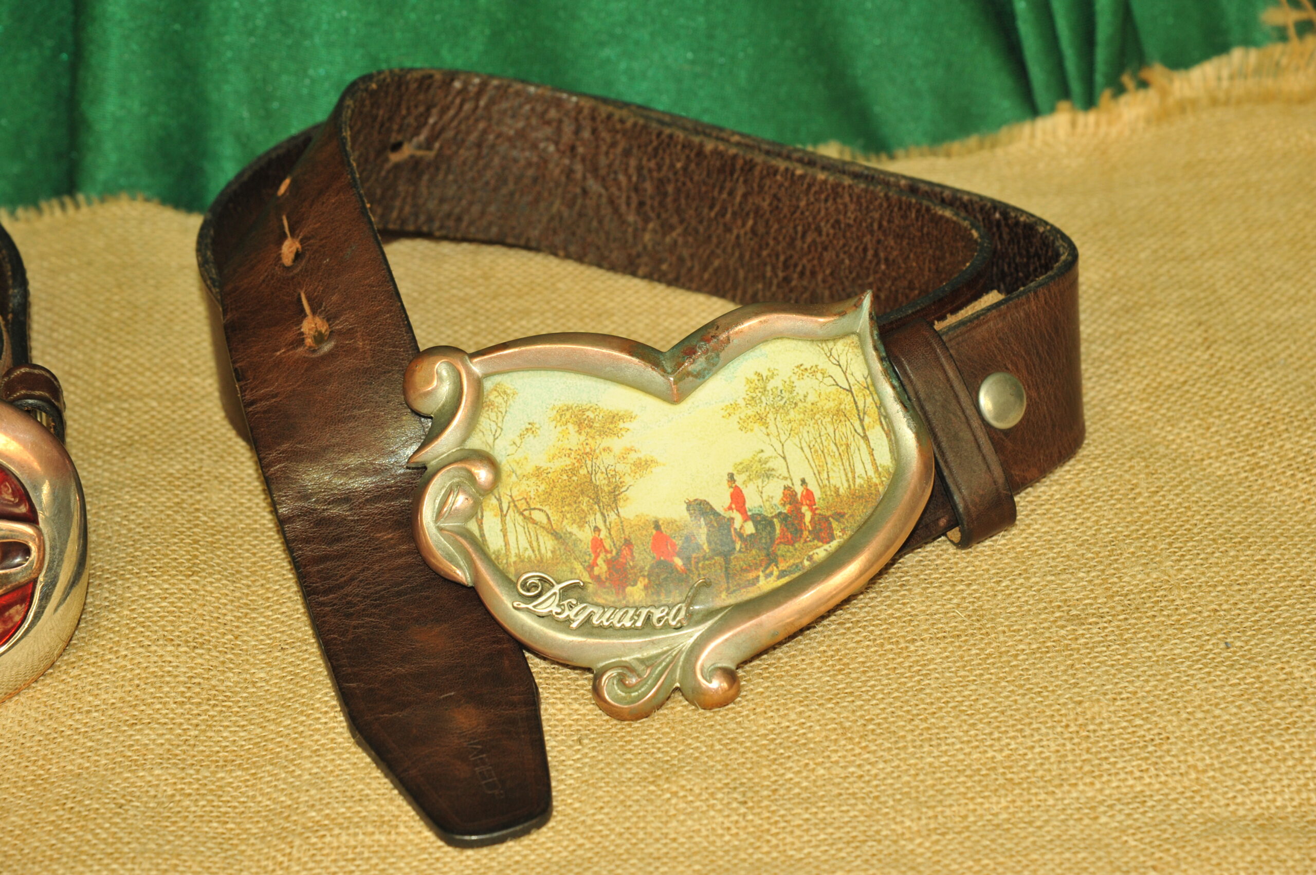 a pair of vintage collectible dsquared leather belts