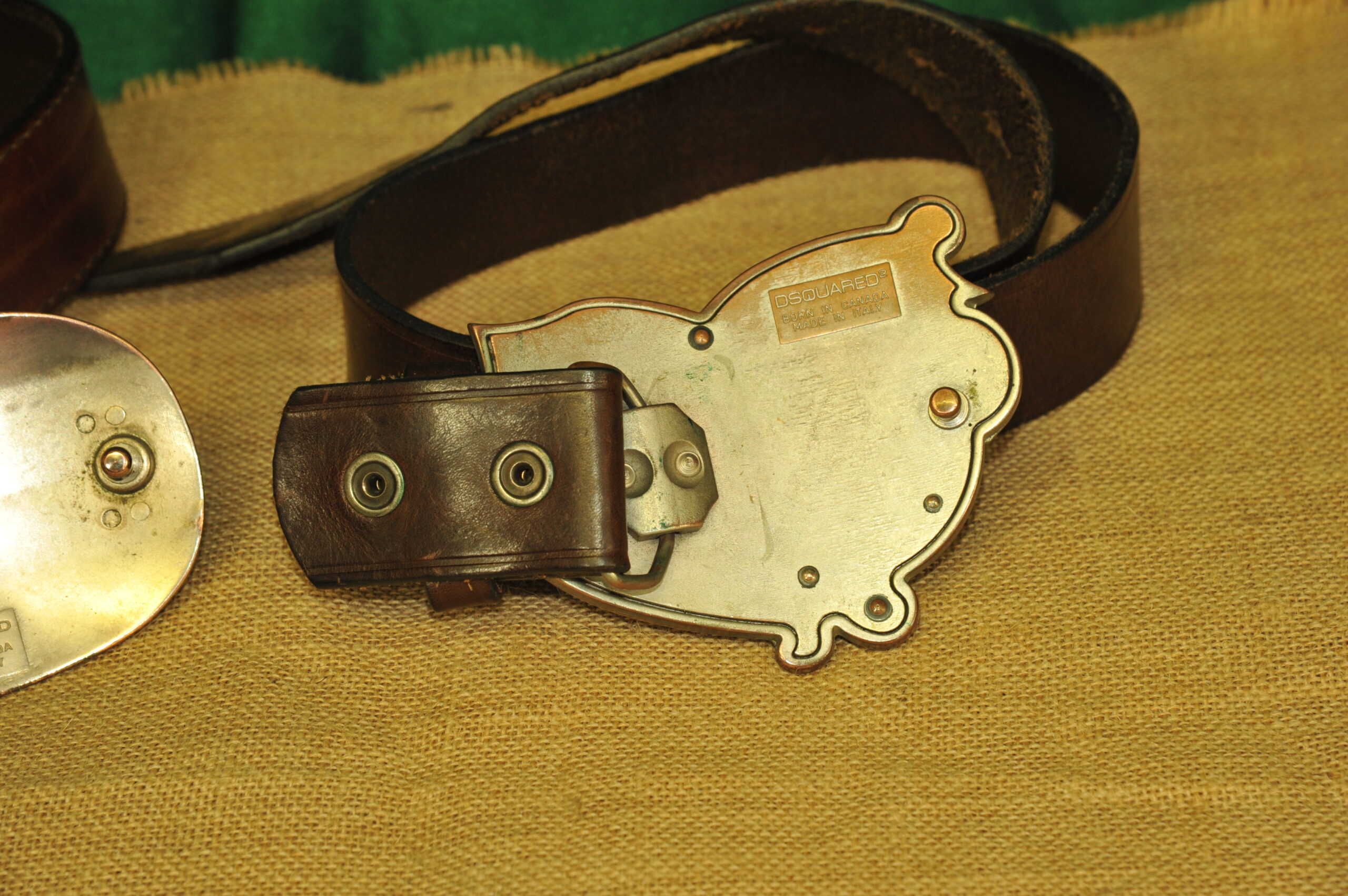 a pair of vintage collectible dsquared leather belts