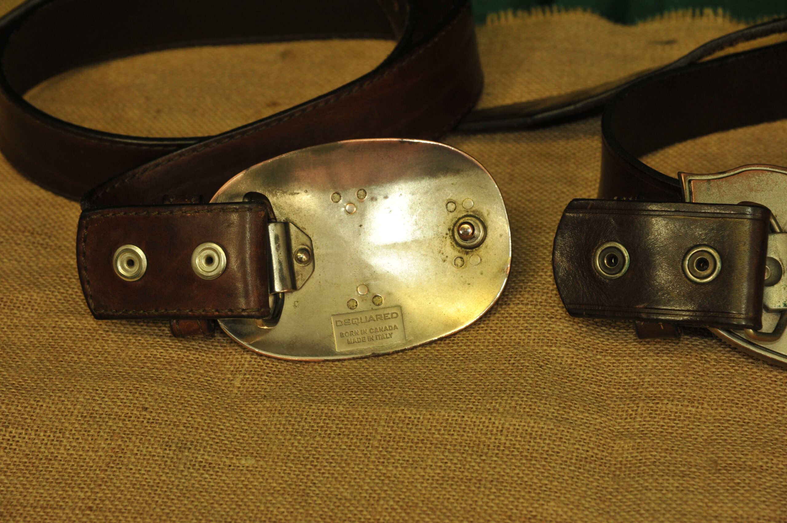 a pair of vintage collectible dsquared leather belts