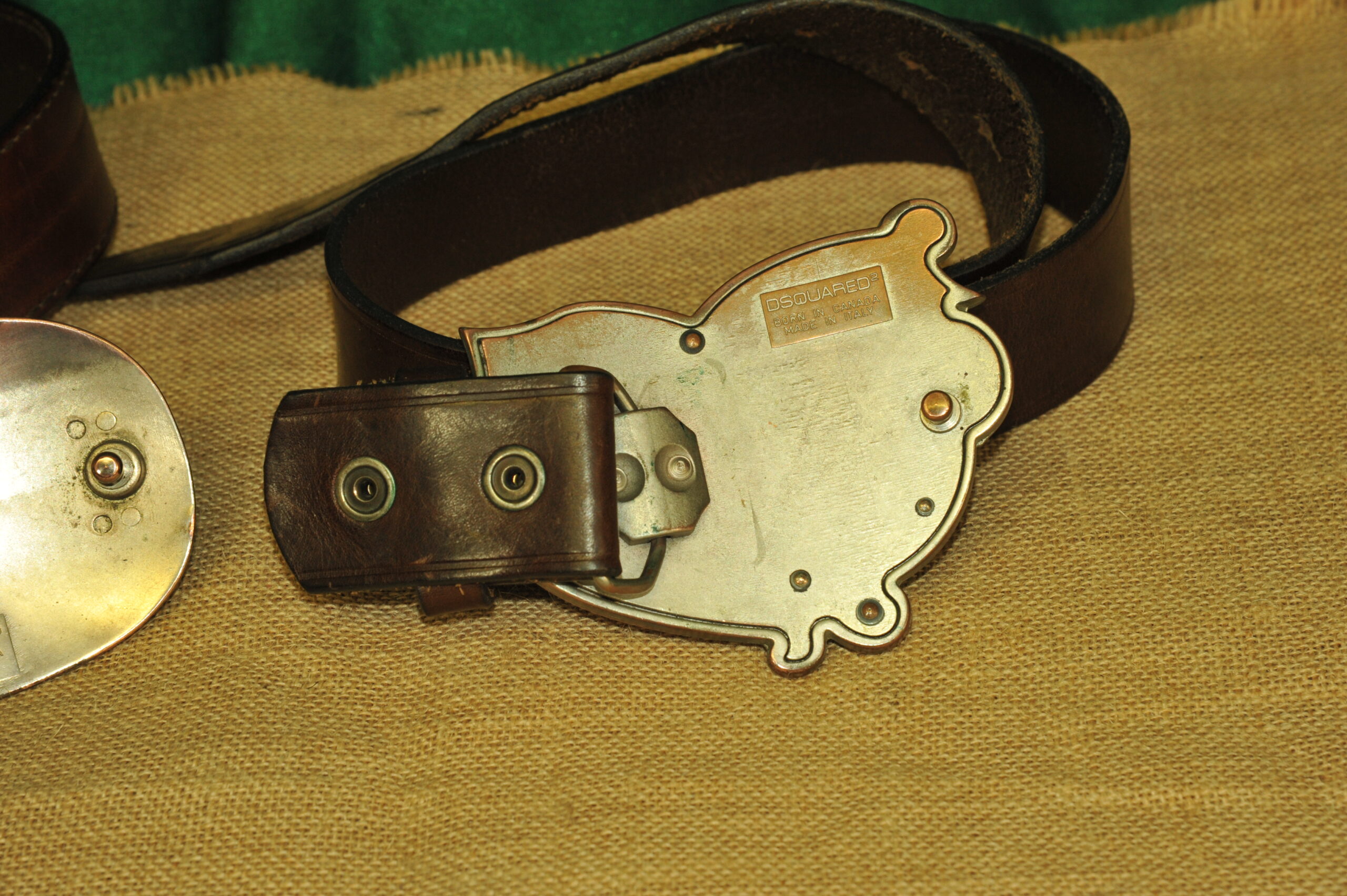 a pair of vintage collectible dsquared leather belts