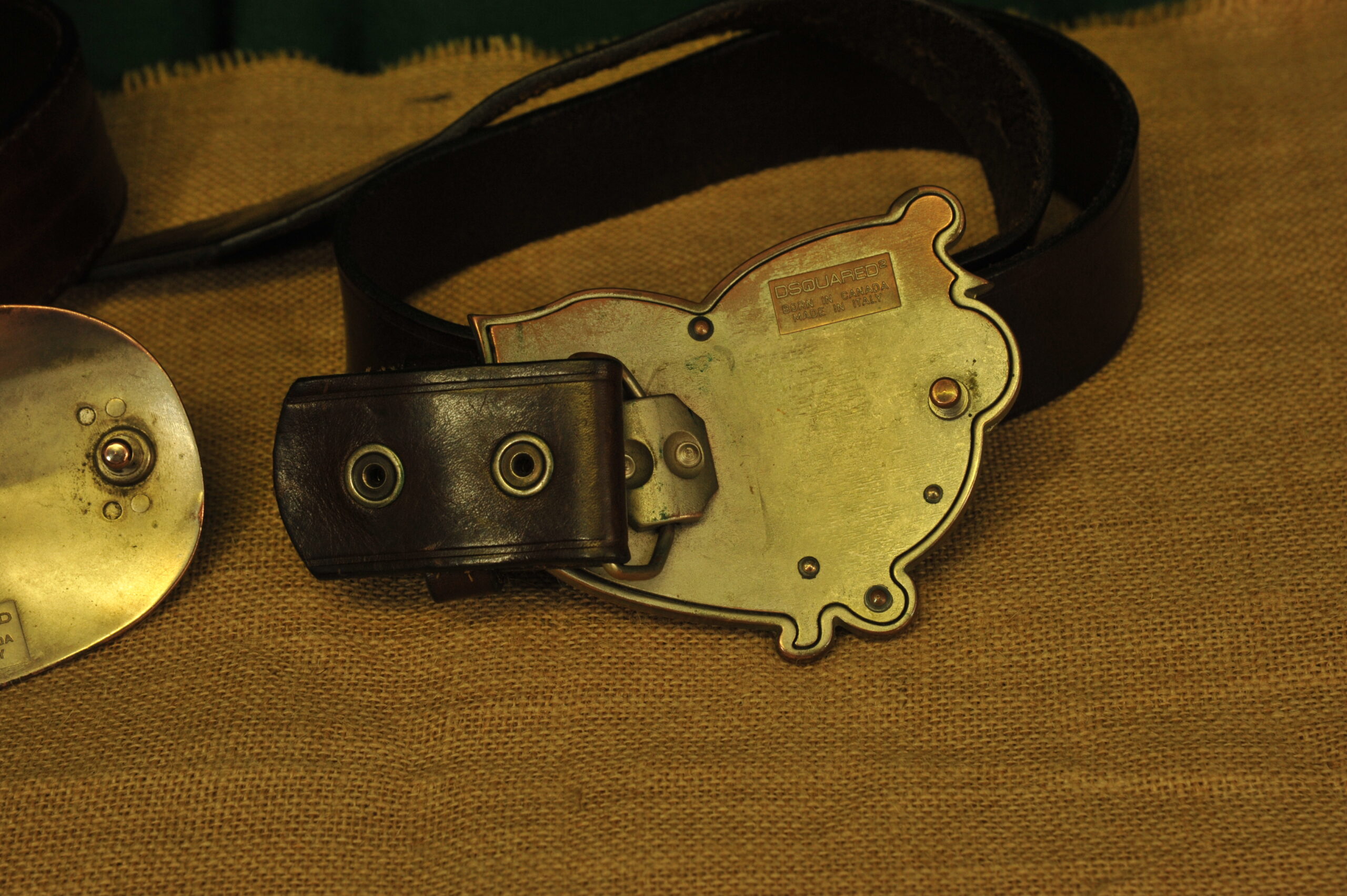 a pair of vintage collectible dsquared leather belts
