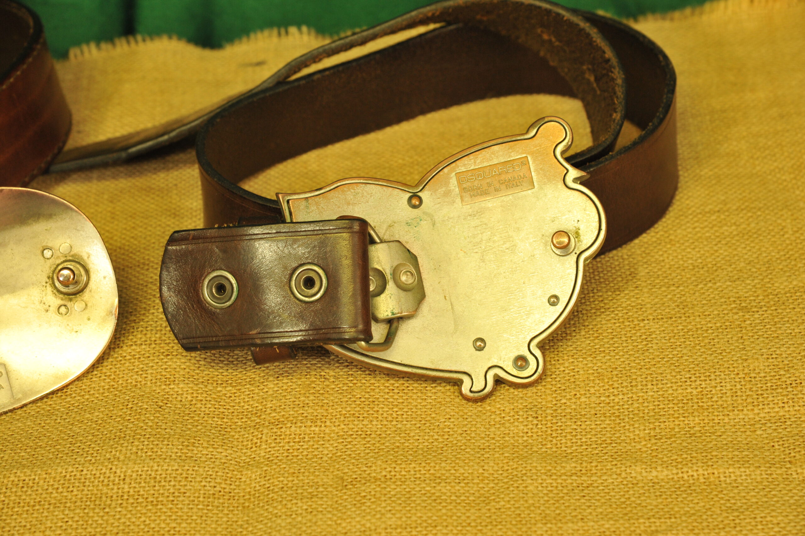 a pair of vintage collectible dsquared leather belts