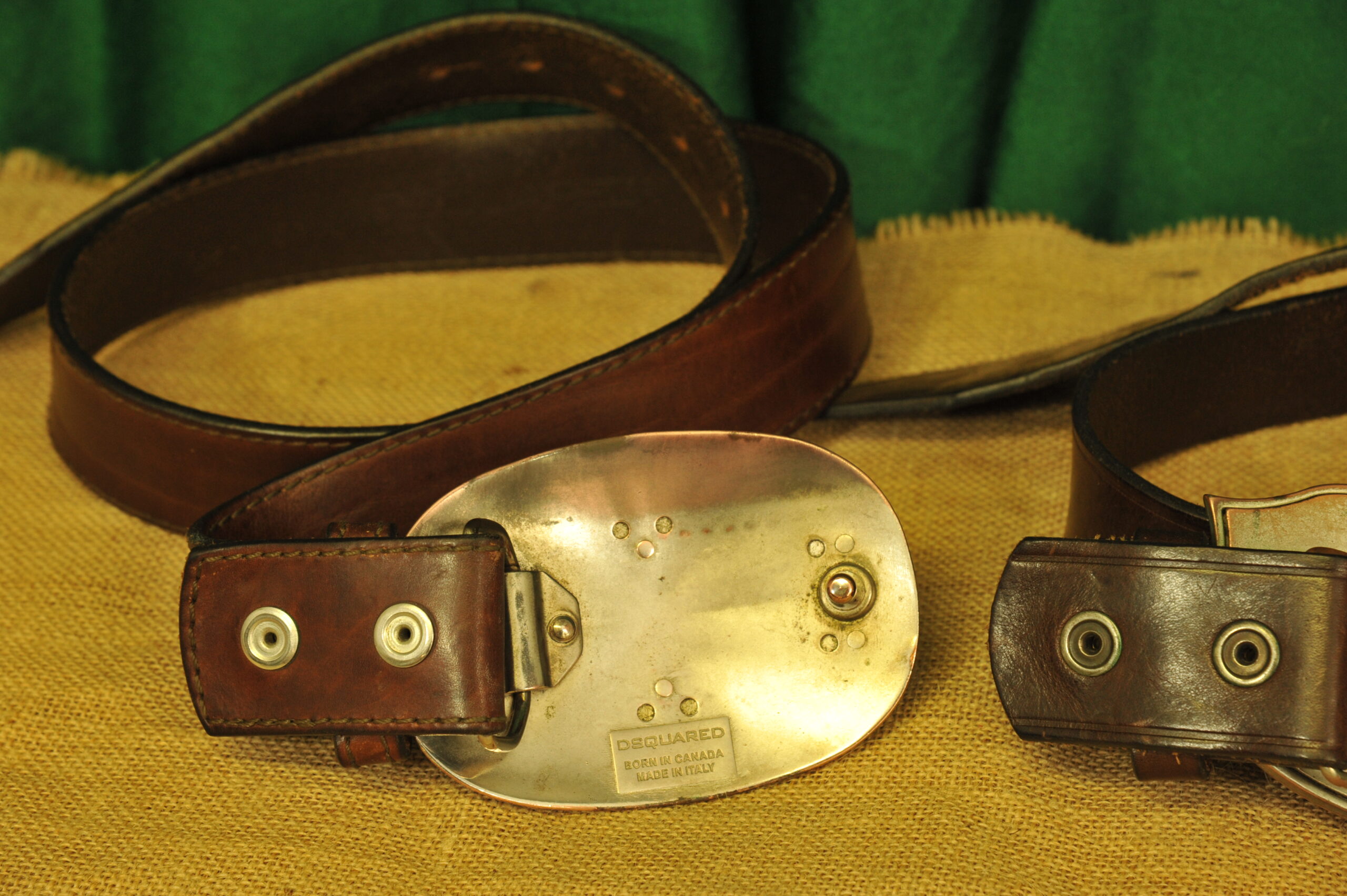 a pair of vintage collectible dsquared leather belts