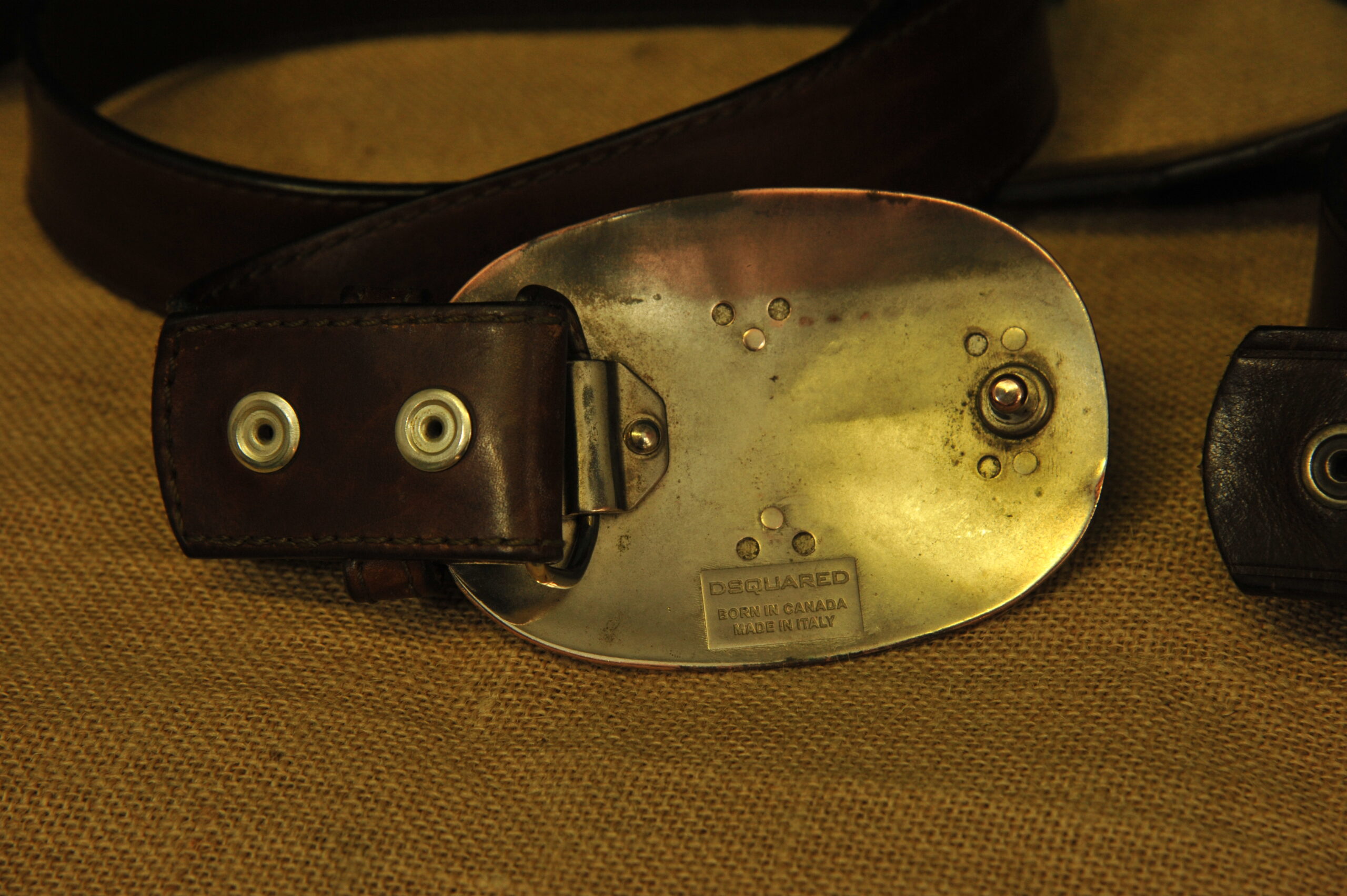 a pair of vintage collectible dsquared leather belts