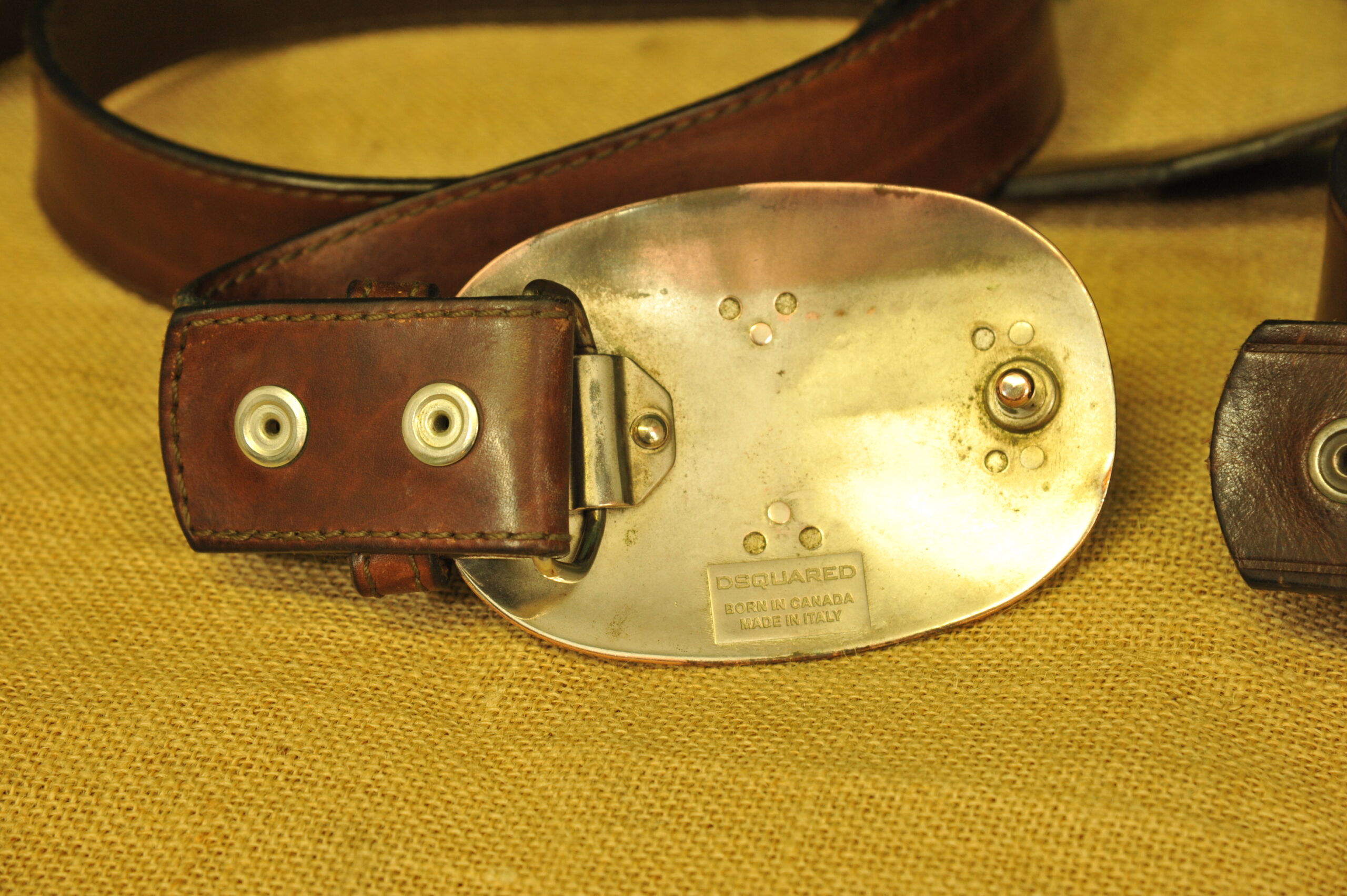 a pair of vintage collectible dsquared leather belts