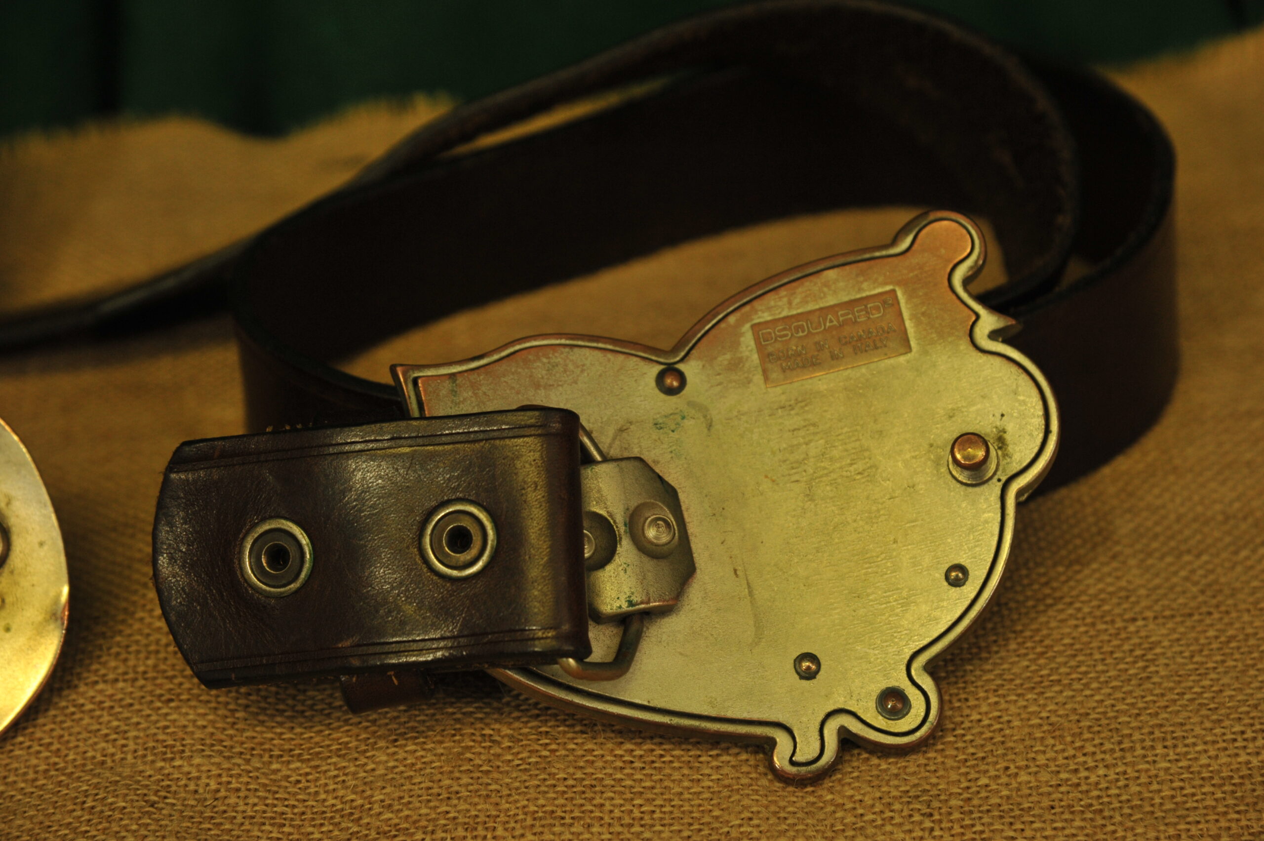 a pair of vintage collectible dsquared leather belts