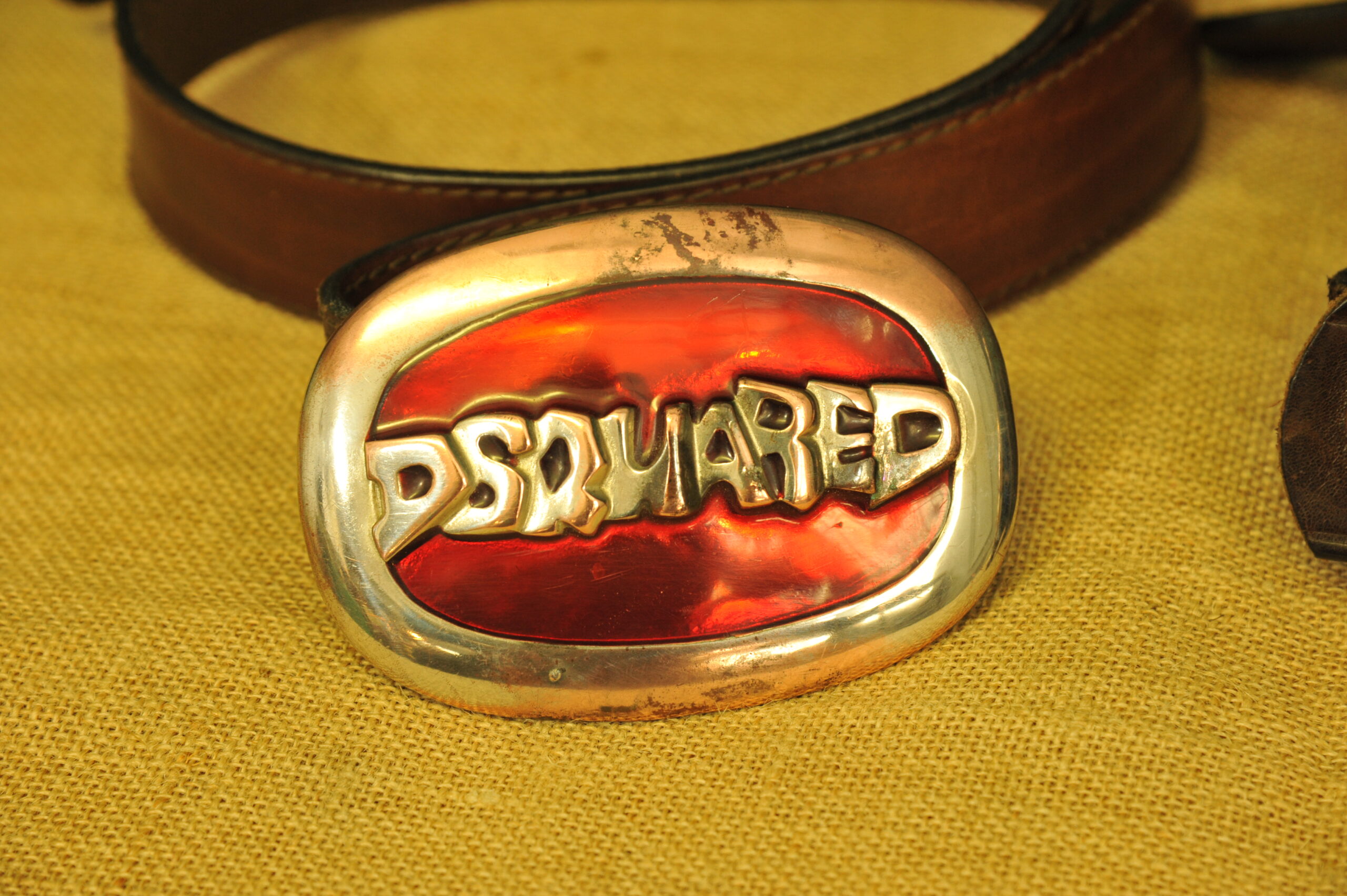 a pair of vintage collectible dsquared leather belts