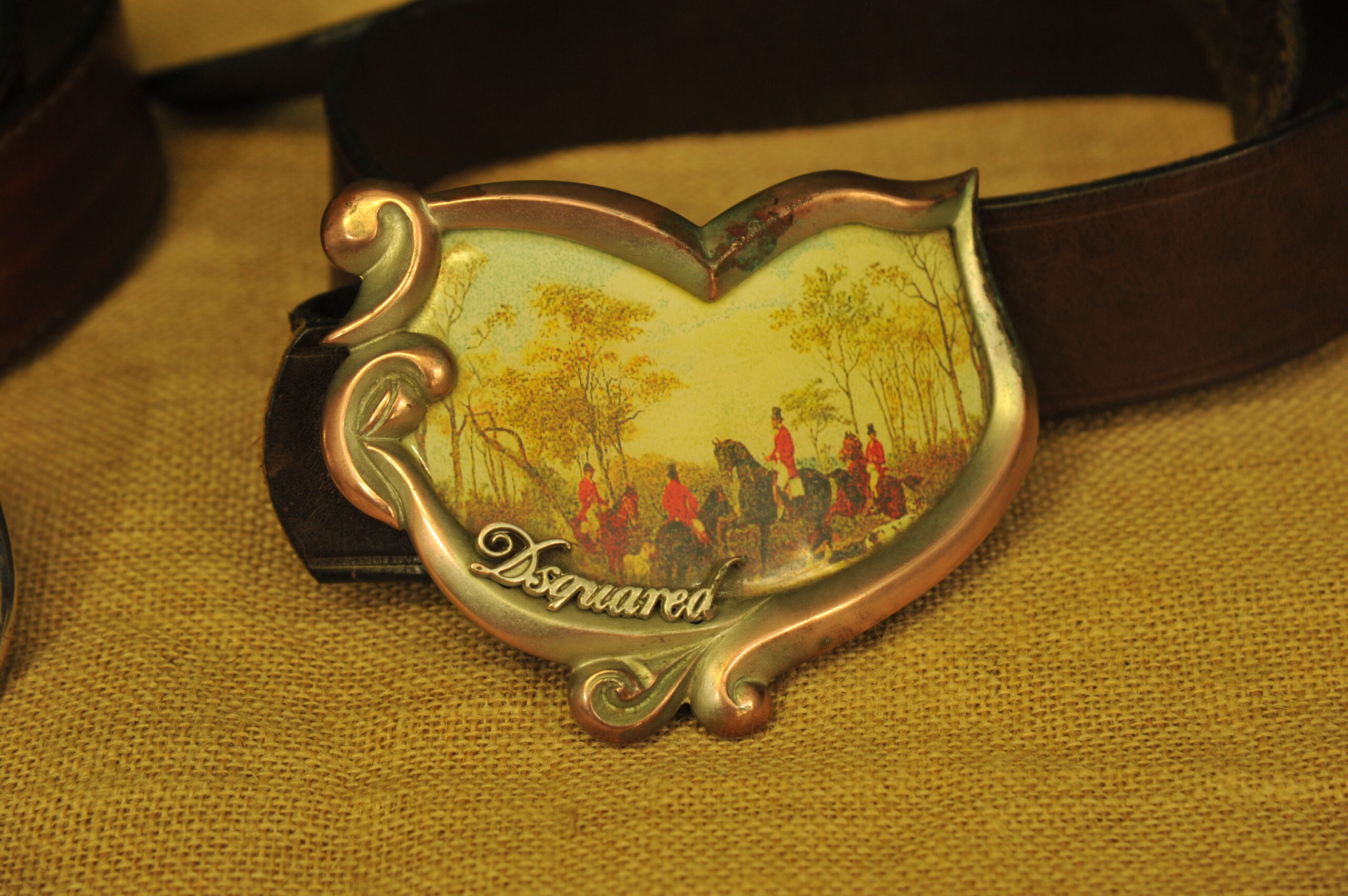 a pair of vintage collectible dsquared leather belts