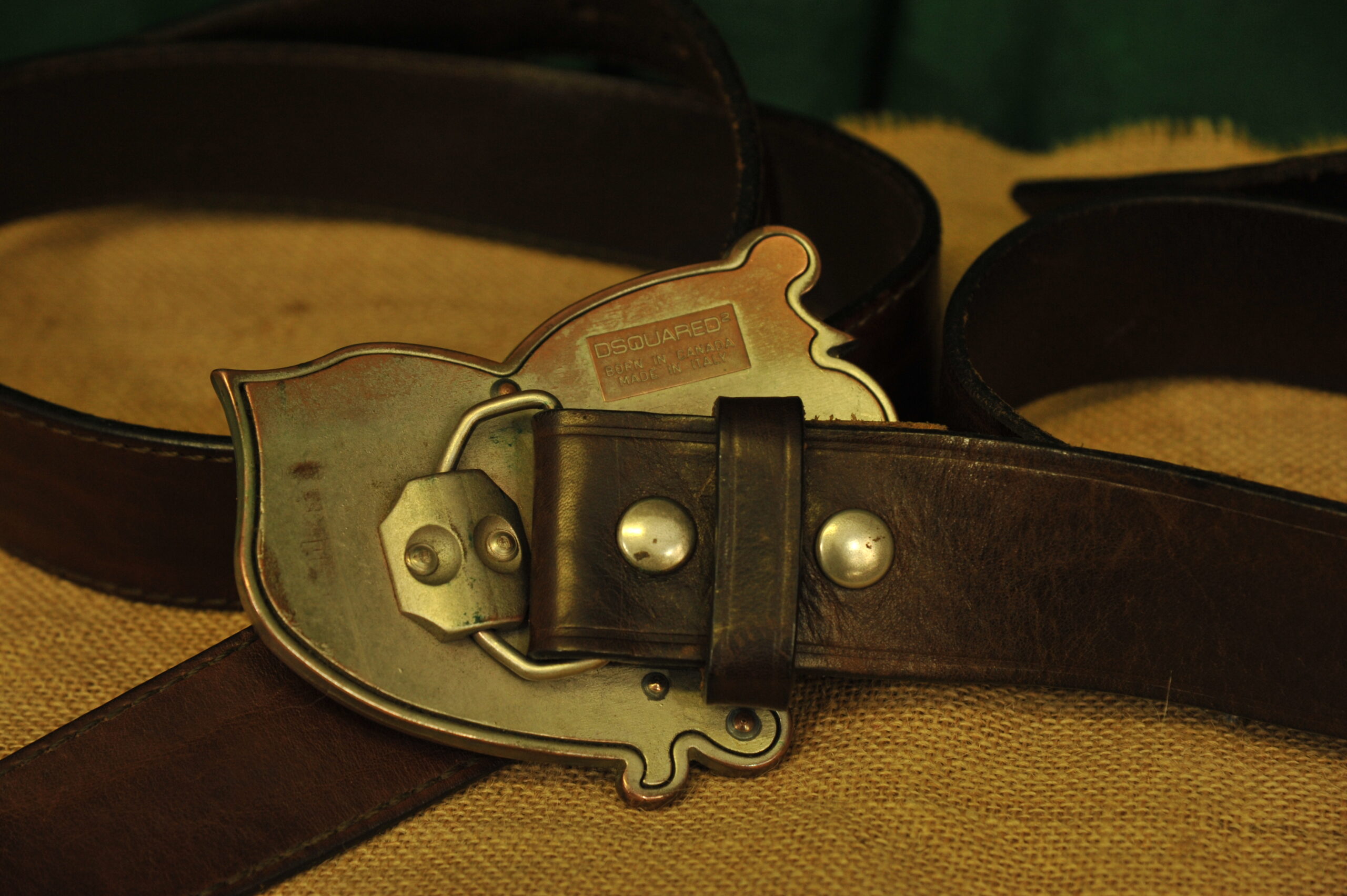 a pair of vintage collectible dsquared leather belts