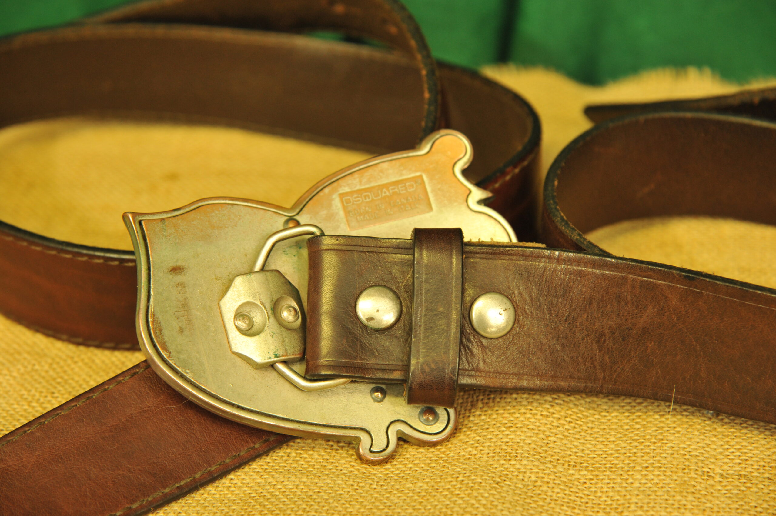 a pair of vintage collectible dsquared leather belts