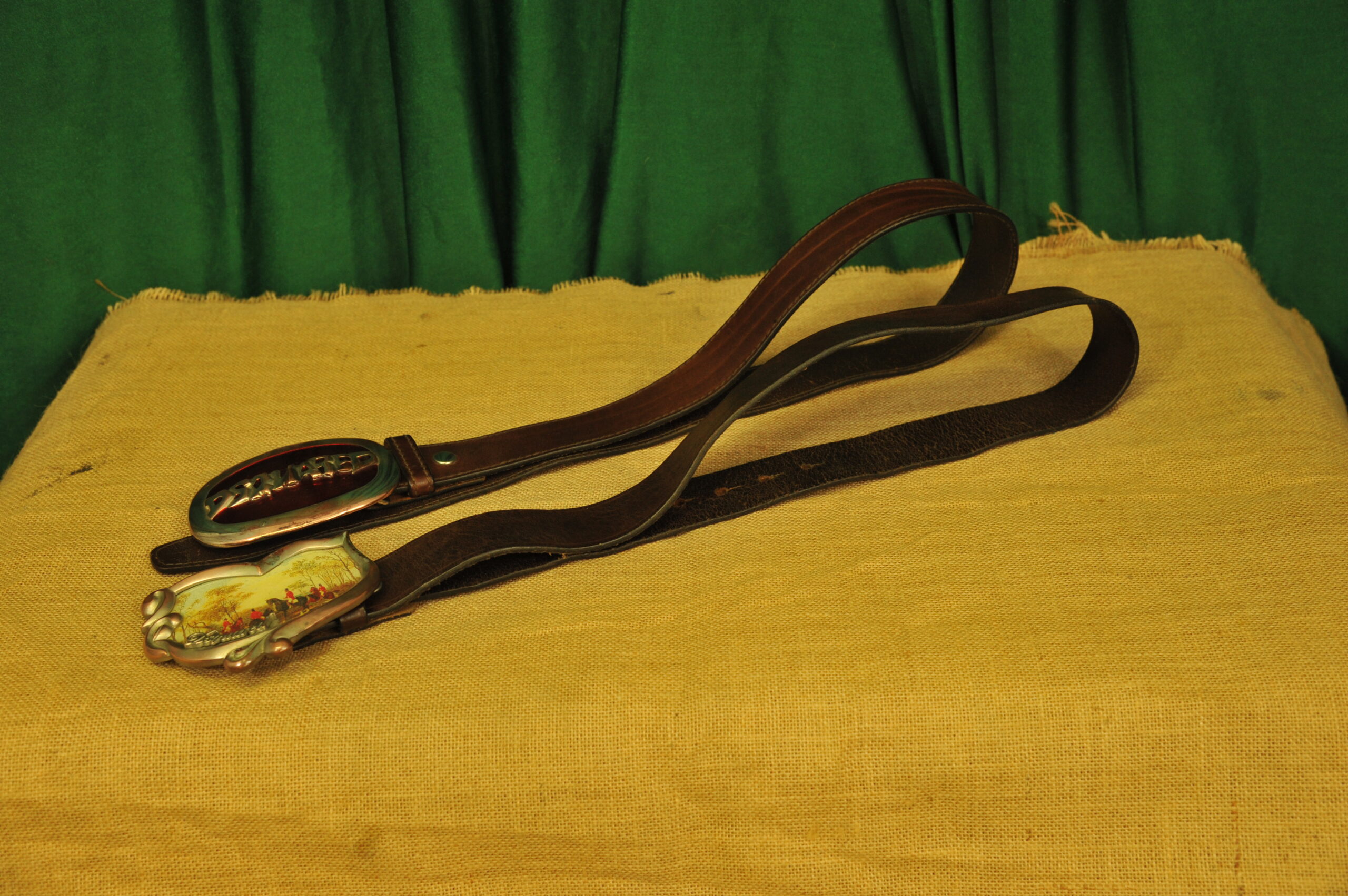 a pair of vintage collectible dsquared leather belts