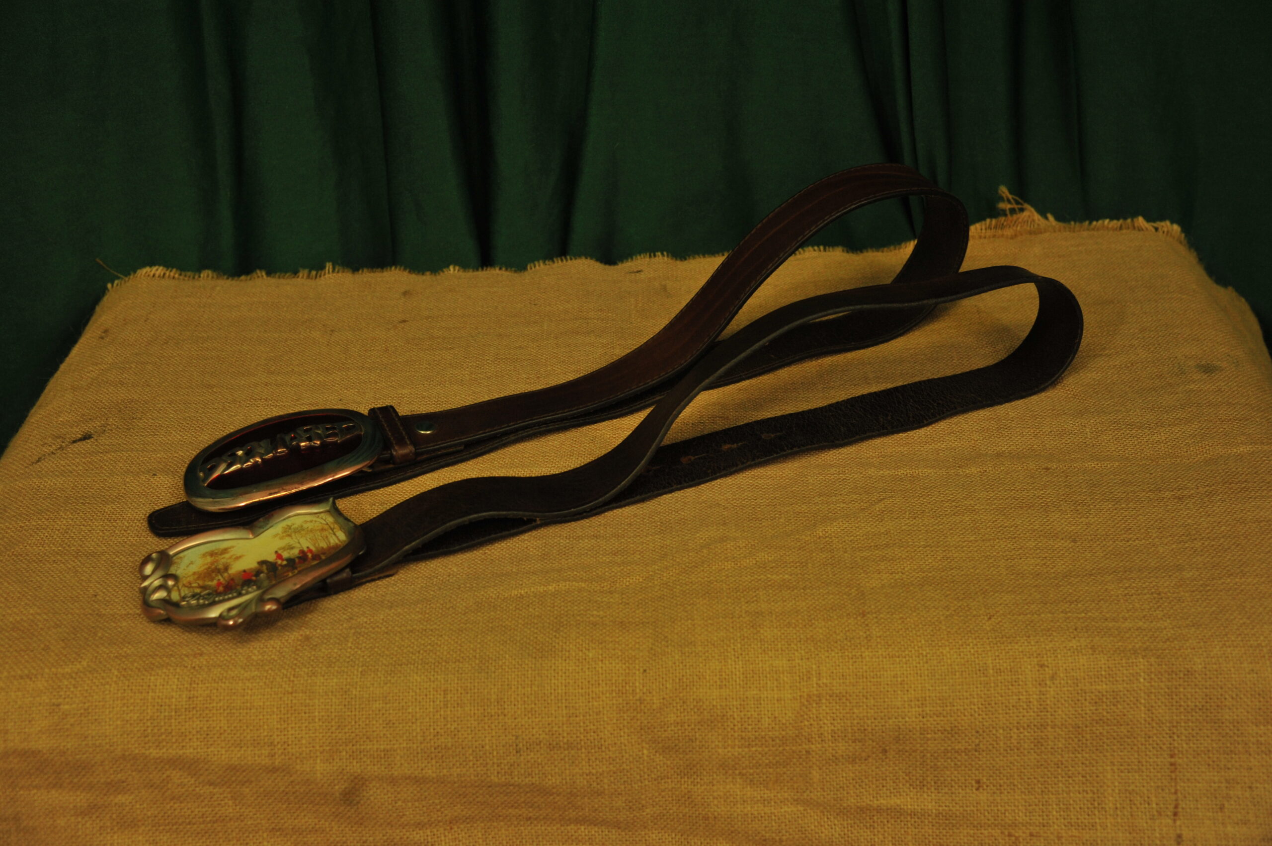 a pair of vintage collectible dsquared leather belts
